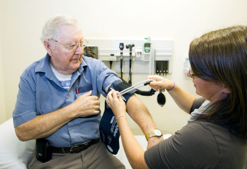 Nurse Practitioner taking blood pressure of older man at North Muskoka Nurse Practitioner-Led Clinic