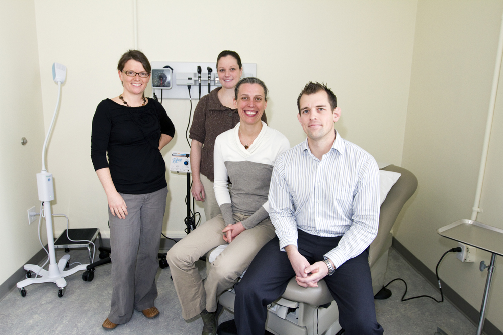 North Muskoka Nurse Practitioner-Led Clinic Staff - Three women and a man posed in a clinic setting